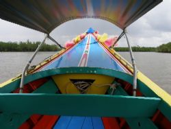 Exploring Phang Nga bay in a colourful long-tail boat by Gordana Zdjelar 
